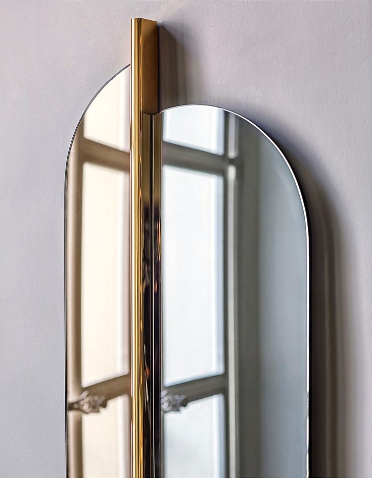 This Luxury Modern Dual-Panel Wall Mirror with Striking Vertical Gold Accent