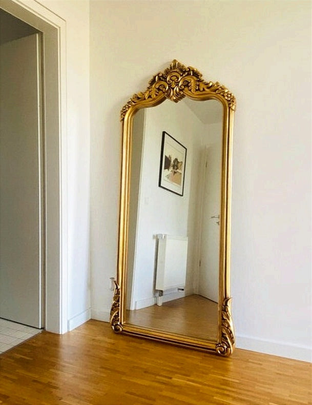 This Luxurious Full-Length Mirror Featuring a Regal Gold Frame Adorned with Intricate Baroque Detailing