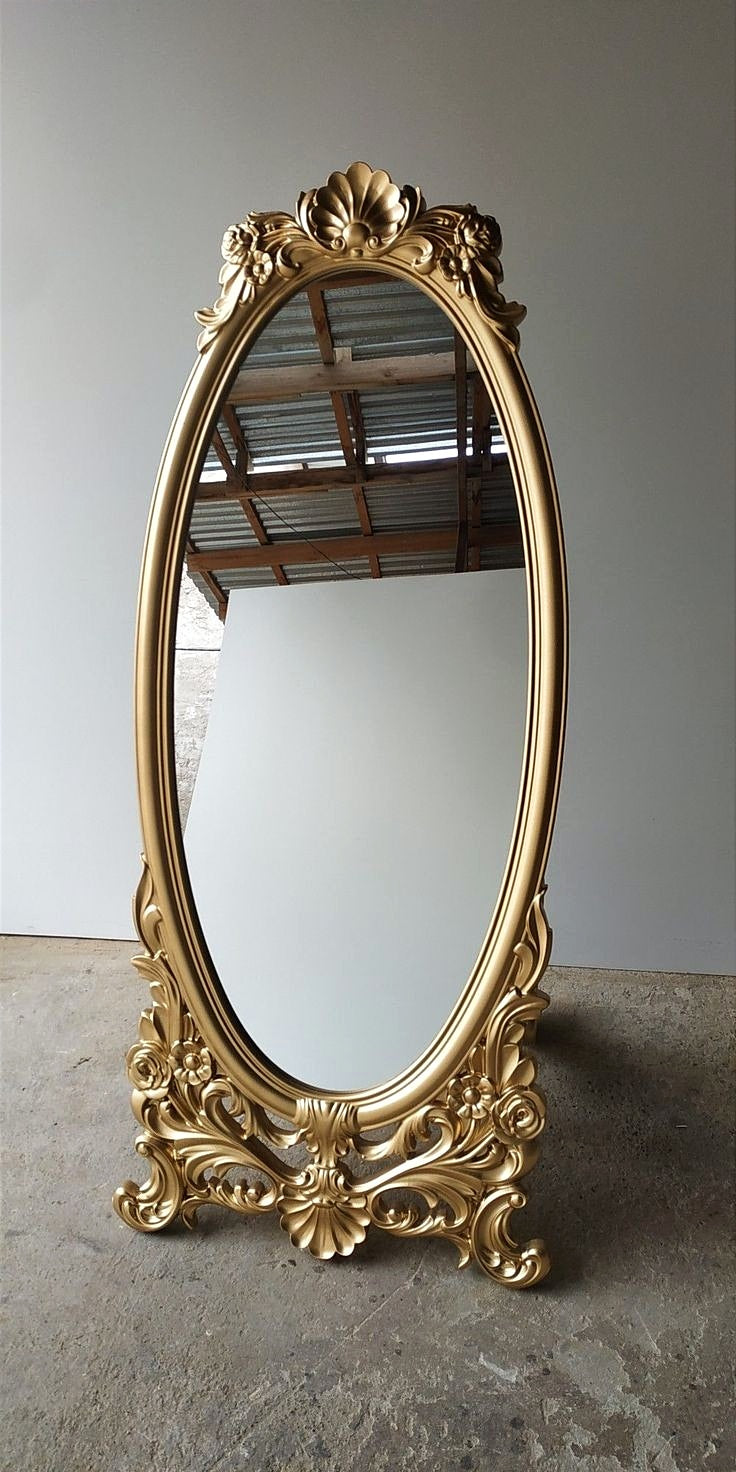 This Luxurious Gold Accent Wall Floor Mirror - Featuring An Elegant Oval Design