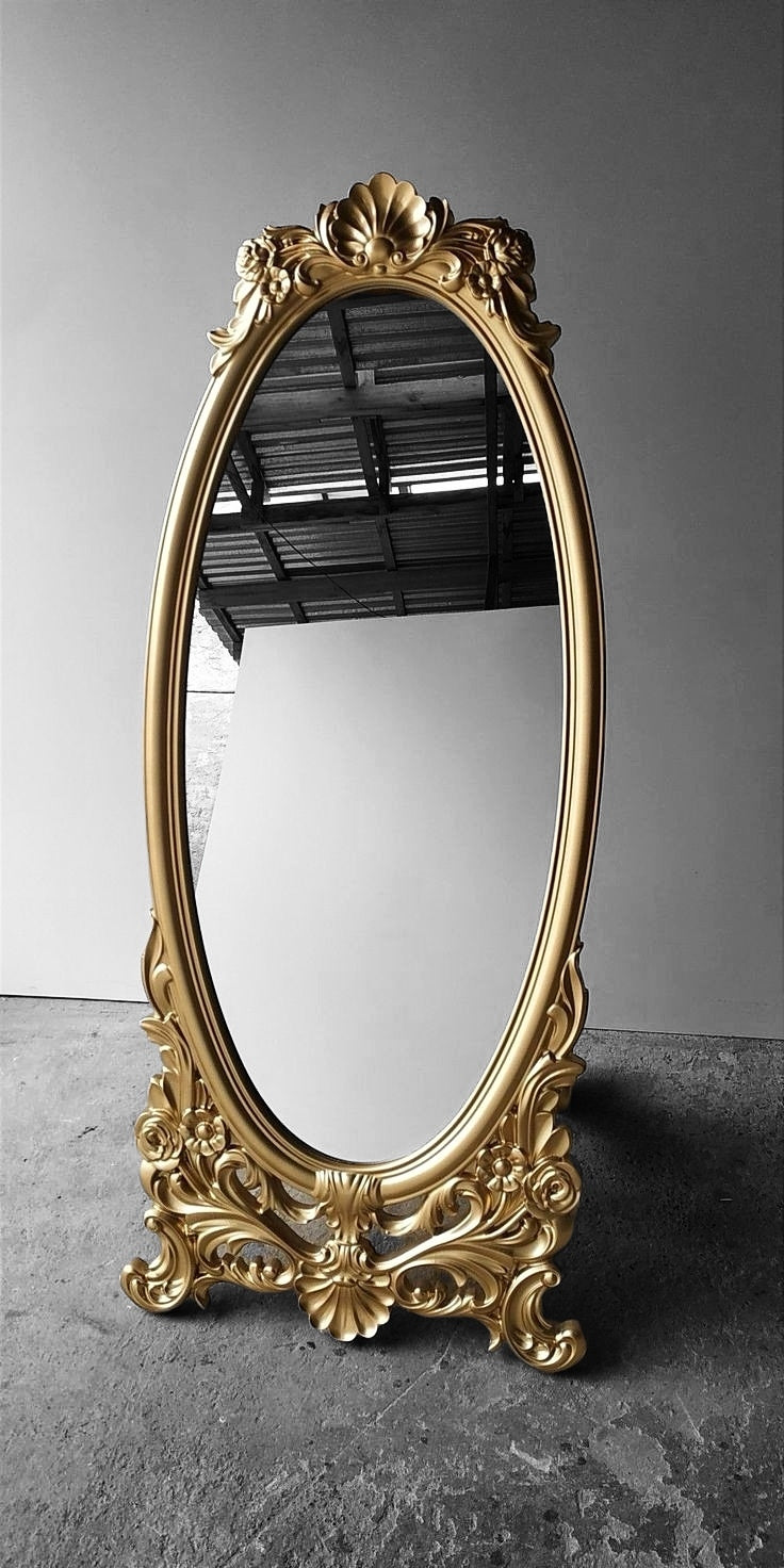 This Luxurious Gold Accent Wall Floor Mirror - Featuring An Elegant Oval Design